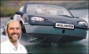Dr Keith Alexander with a publicity photo of the new Aquada