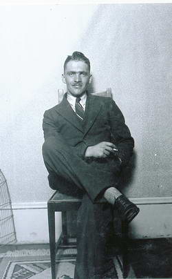 Guy Menzies relaxing at the Hokitika Post Office residence, second floor Post Office building, Hokitika, 7/1/1931
