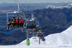 Lake and mountain views riding the express chairlift at Treble Cone