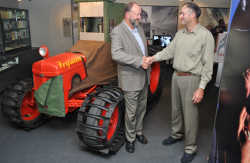 Denis Callesen (left) congratulates John Callesen on the replica Ferguson tractor.