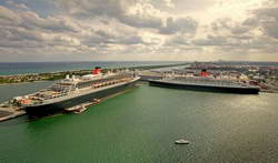 The huge Cunard Queens, Queen Mary 2 and QE2. nose to nose in Fort Lauderdale, Florida, just before they sailed off to begin their world voyages which will bring them both to NZ in February.