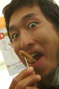 A visitor tries a new taste � a duck tongue