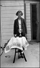 Adelaide with the cups she won for cooking