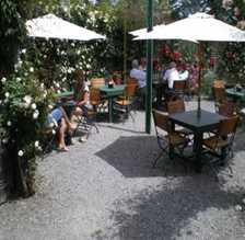 The outdoor tables in the garden setting