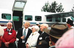 Greetings on arrival, from left facing camera, Dr Max Wearne,<br>Dick Smith, Mrs Kathleen Henderson - sister of aviator,<br>and Dr Bruce Menzies - brother of pioneer aviator.