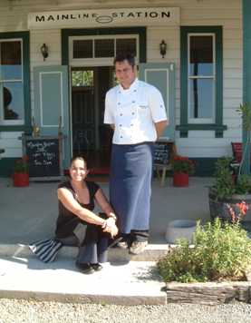 John & Esther Cann on the steps of the restaurant
