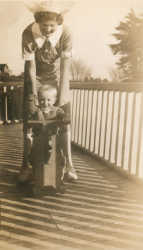 A Karitane nurse with a small child in her care.