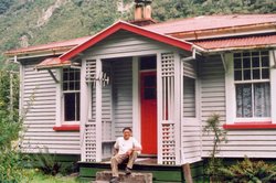 Resident Arthur McIver in front of the house available as a motel unit