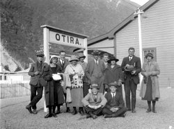 A group of teachers from Addington School in Christchurch wait for the train at the Otira Station in 1926