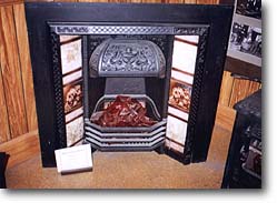 A fireplace displayed in the museum of Scott Bros' products